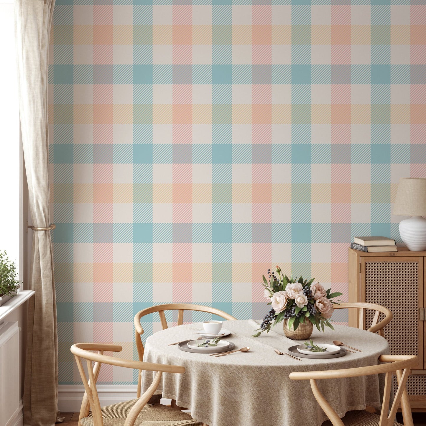 Vichy pattern wallpaper in a breakfast nook with a round wooden table.