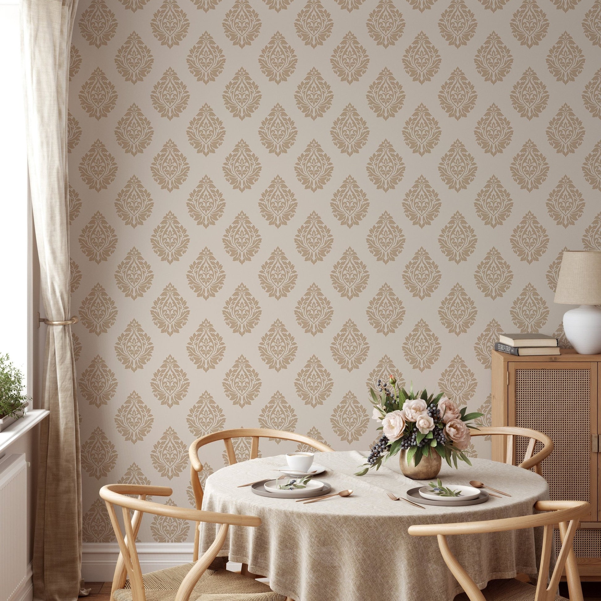 Repeat pattern wallpaper in a dining space with a round table and wooden chairs.