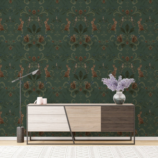Dark green forest wallpaper behind a modern wooden sideboard in living room.