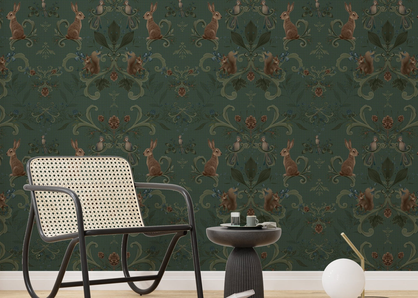 Victorian forest woodland animals green color wallpaper with a black chair in sitting area.