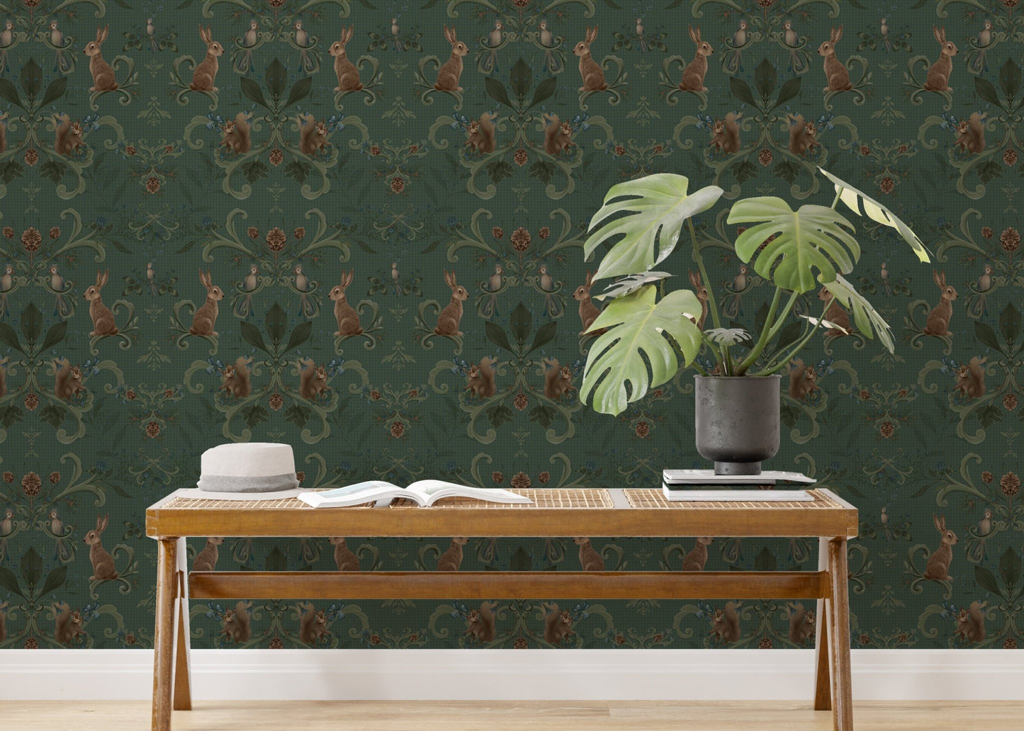 Woodland animals wallpaper in a study space with a wooden desk and plant.