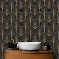 Gold accented Art Deco wallpaper in bathroom behind white vessel sink.