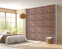 Bedroom featuring a bed and rustic red brick wallpaper.