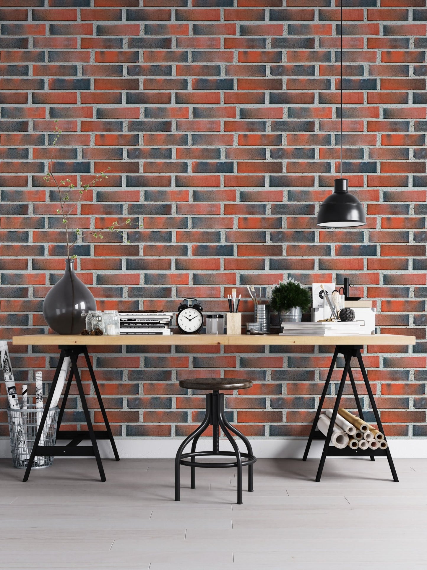 Home office desk setup with a red lining brick wallpaper.