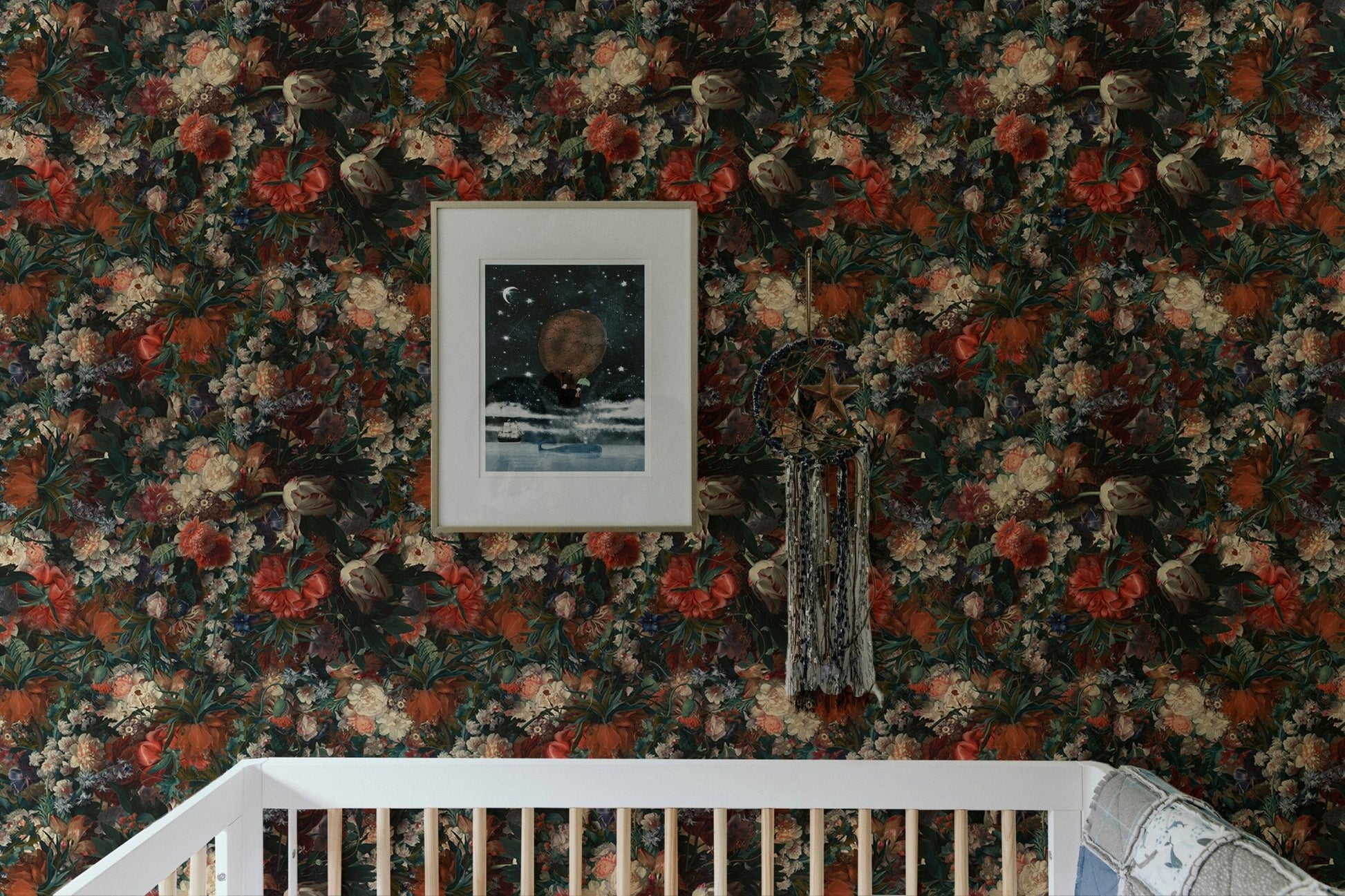 Dark botanical flower wallpaper installed above a baby crib in a neutral nursery.