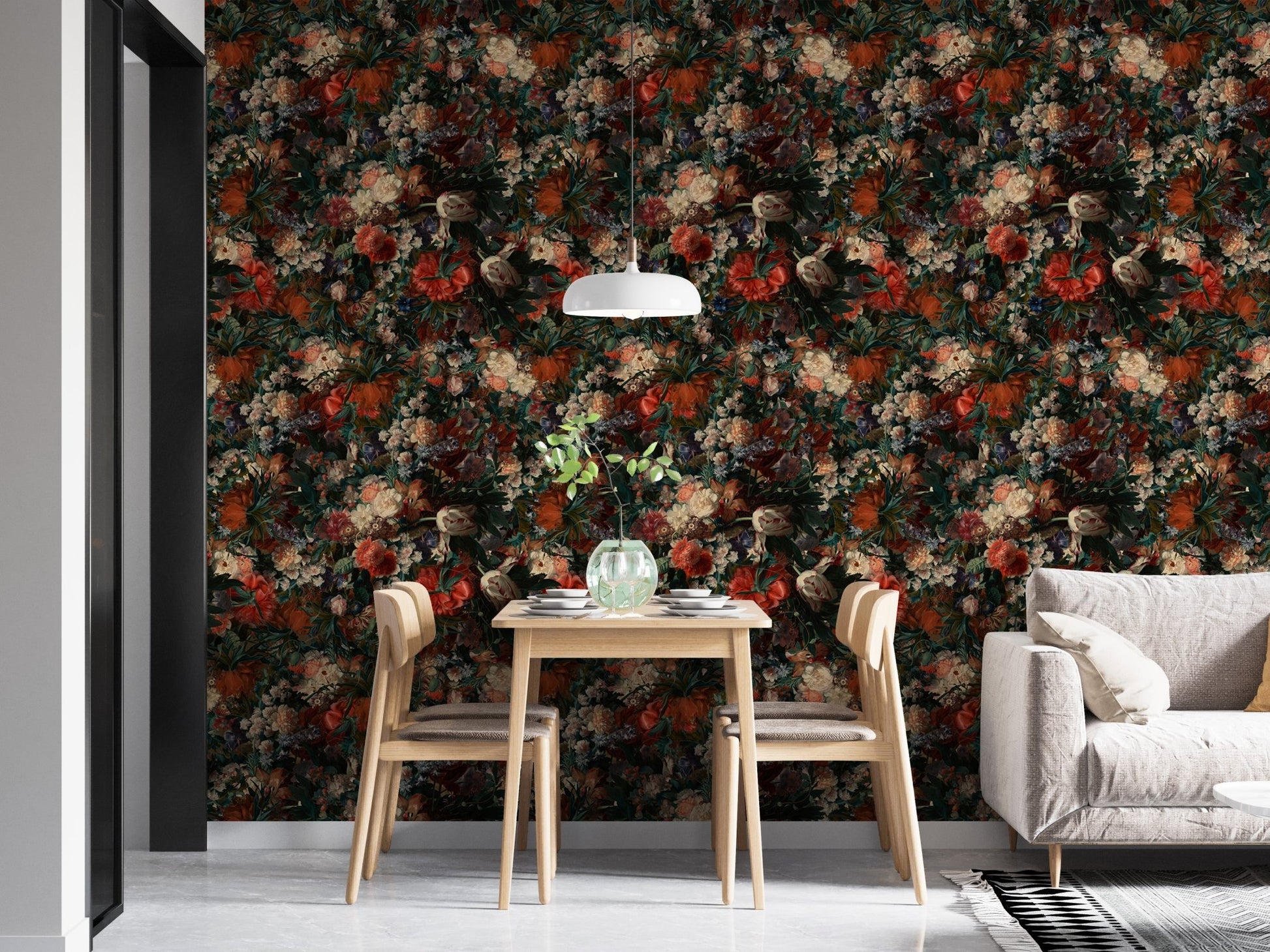 Dining room featuring a dark floral wallpaper accent wall and light wood furniture.