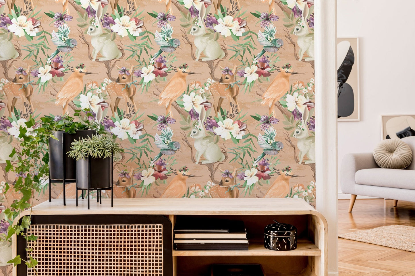 Woodland forest wallpaper in a hallway featuring a wooden sideboard and green plant