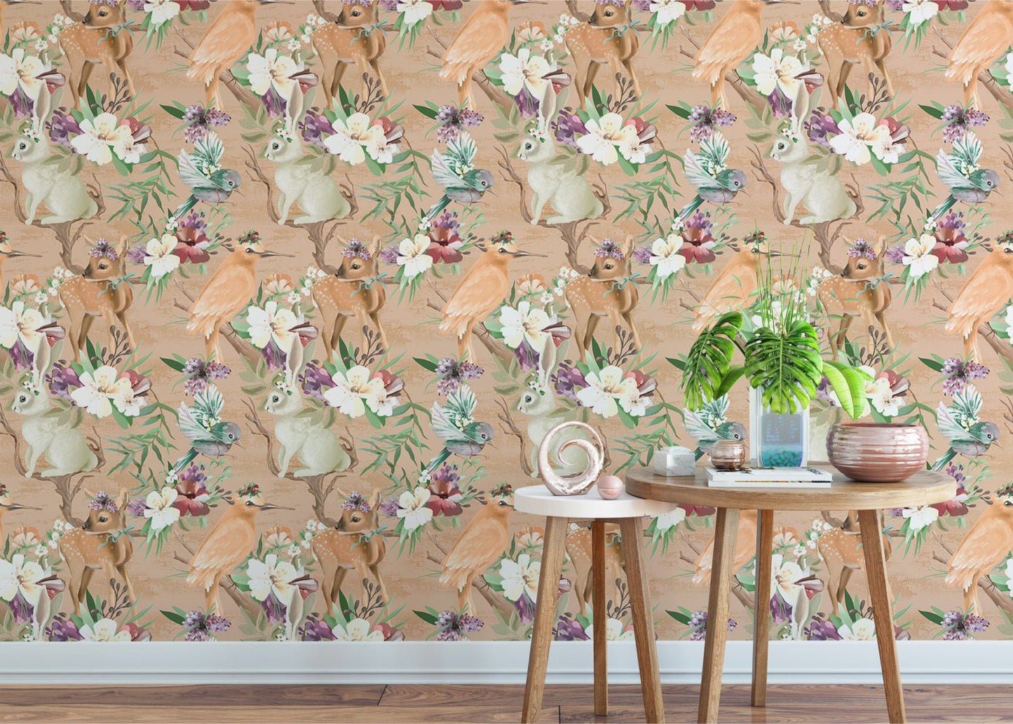 Woodland bird and rabbit wallpaper behind a small wooden table and plant