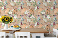 Animal and bird pattern wallpaper in a dining area with white chairs and table