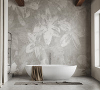 Grey leaf pattern wall mural in a white luxury bathroom with a tub.