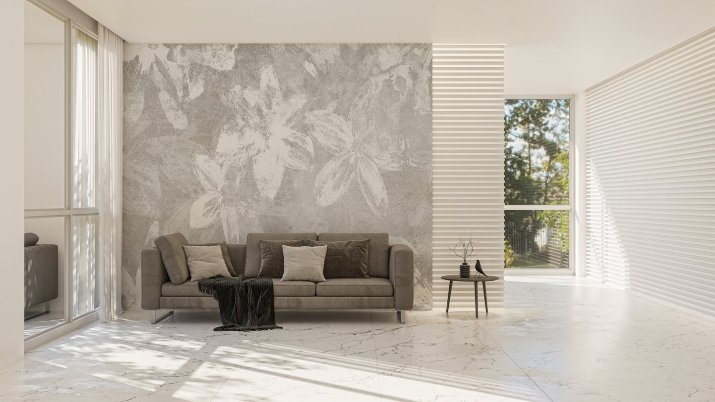 Textured grey wall mural with white floral art in a living space.