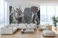 Large scale desert leaves wall mural in a minimalist apartment with white furniture.