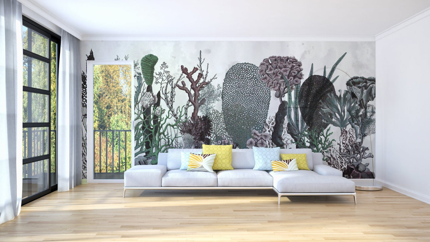 Abstract green cactus wall mural behind a white sectional sofa in a large living room.