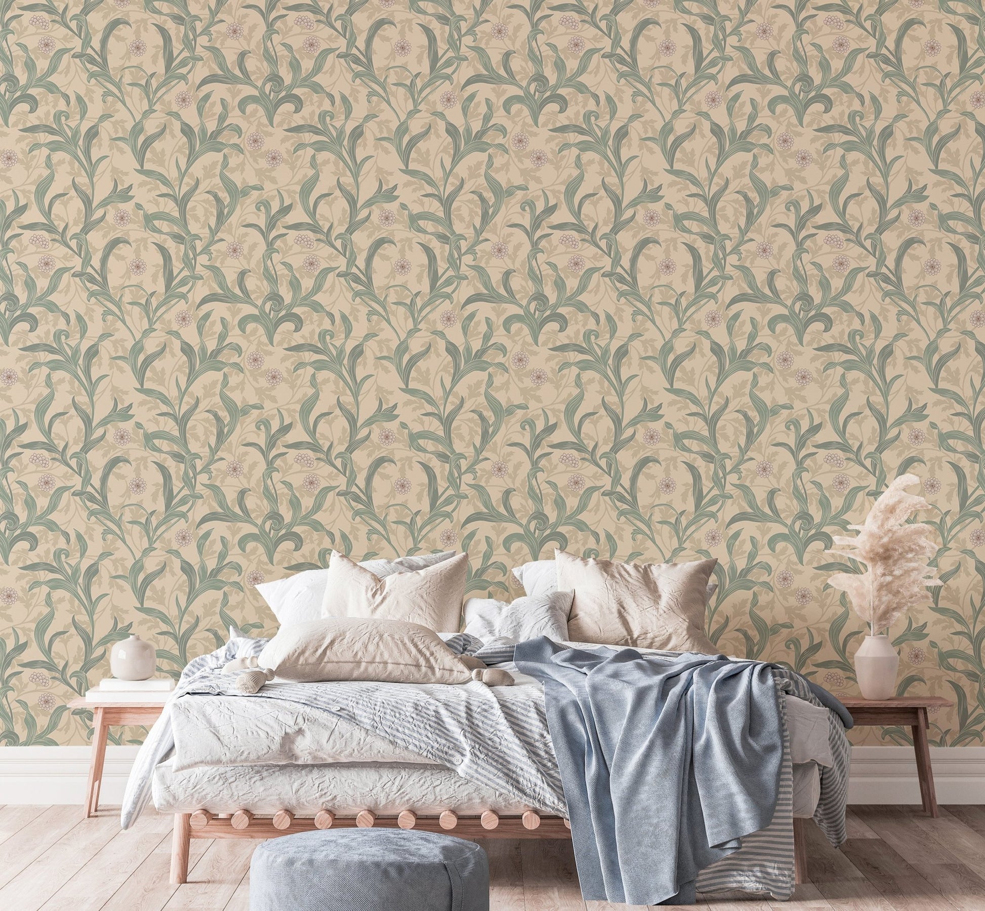 Vintage floral wallpaper behind a white bed with blue throw blanket.