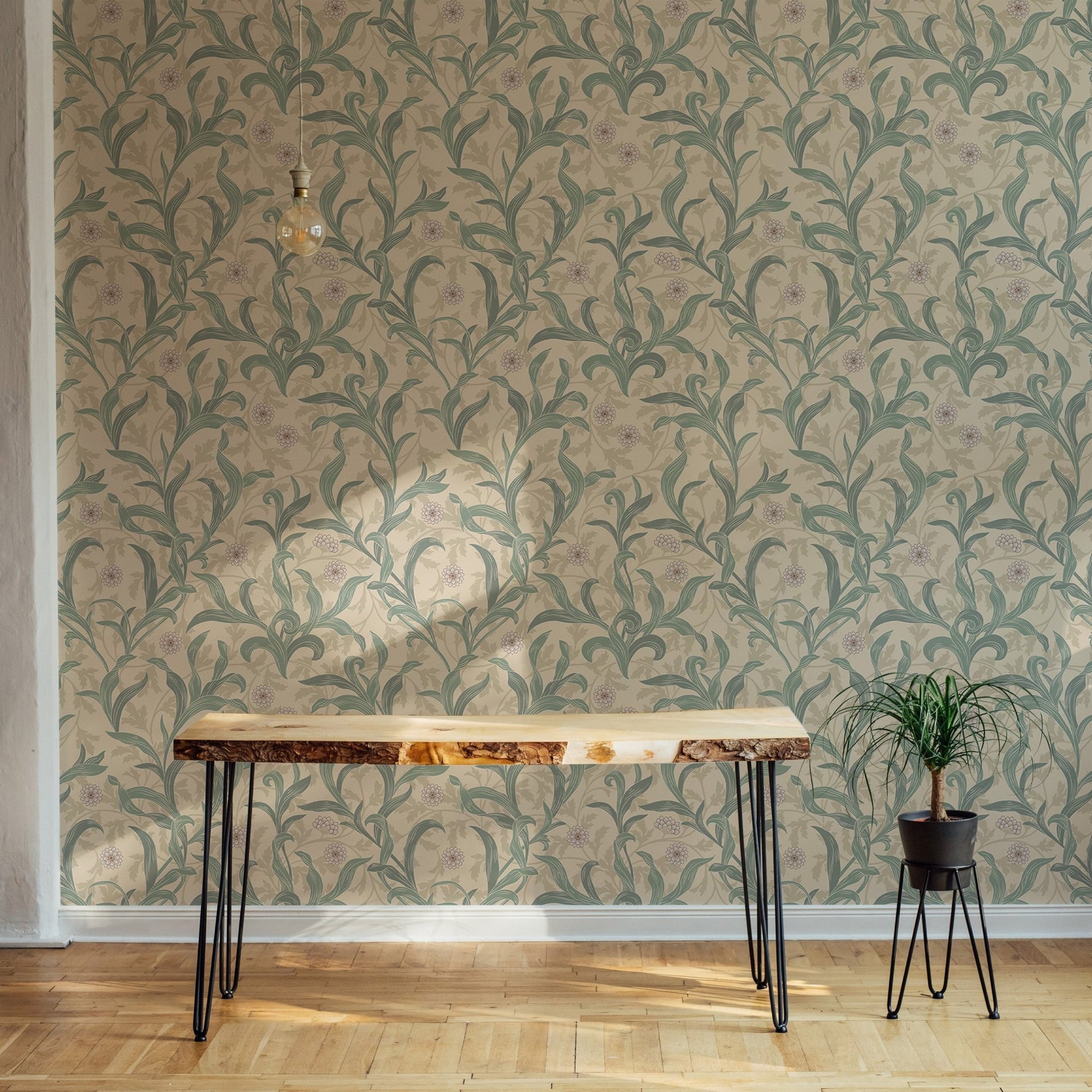 Minimalist desk set against a vintage green flower leaf wallpaper.