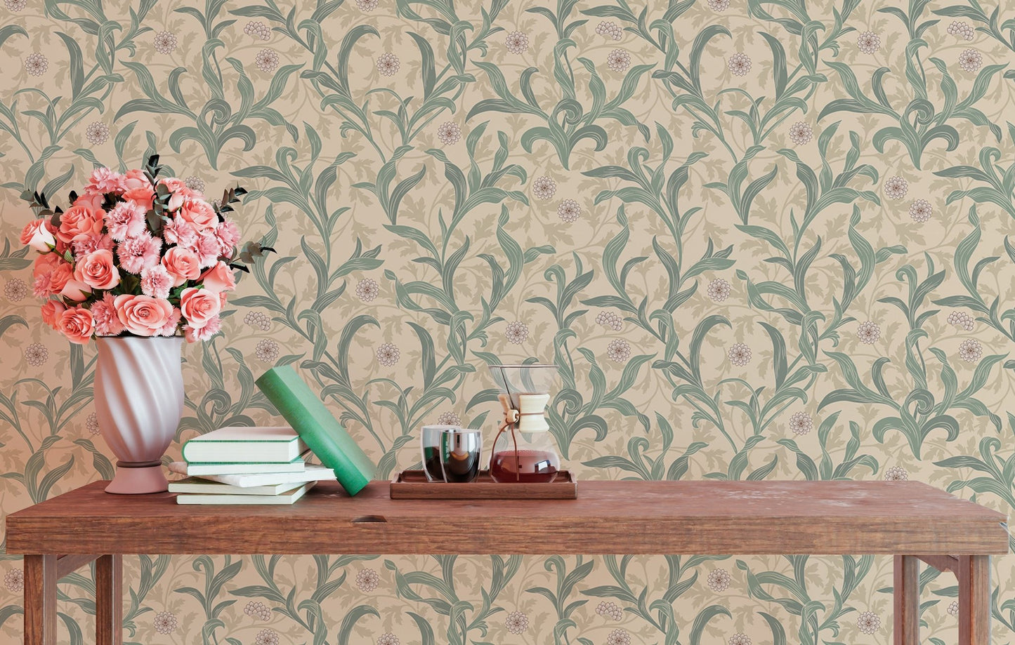 Wooden table with pink flowers against green leaf print wallpaper.