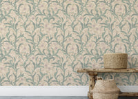 Wooden bench sitting in front of a vintage flower leaf wallpaper.