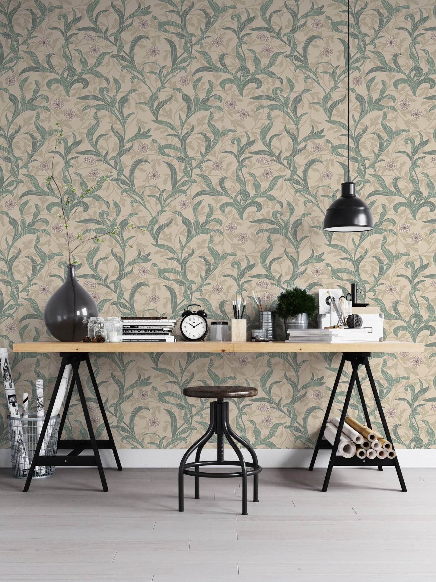 Home office space featuring green botanical leaf wallpaper pattern.