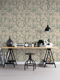 Home office space featuring green botanical leaf wallpaper pattern.