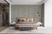 Floral hummingbird wallpaper as a bedroom feature wall with a brown leather bench.