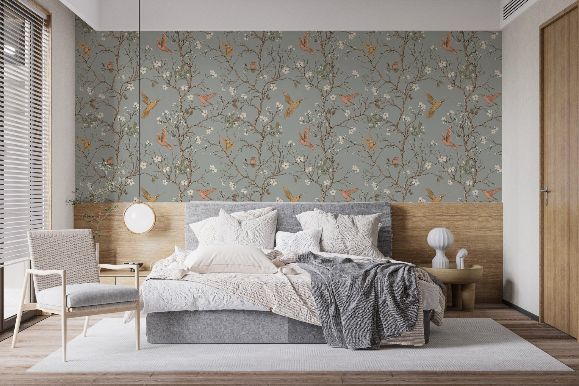 Neutral tones in a bedroom with hummingbird wallpaper and wooden wall panels.