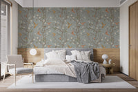 Neutral tones in a bedroom with hummingbird wallpaper and wooden wall panels.