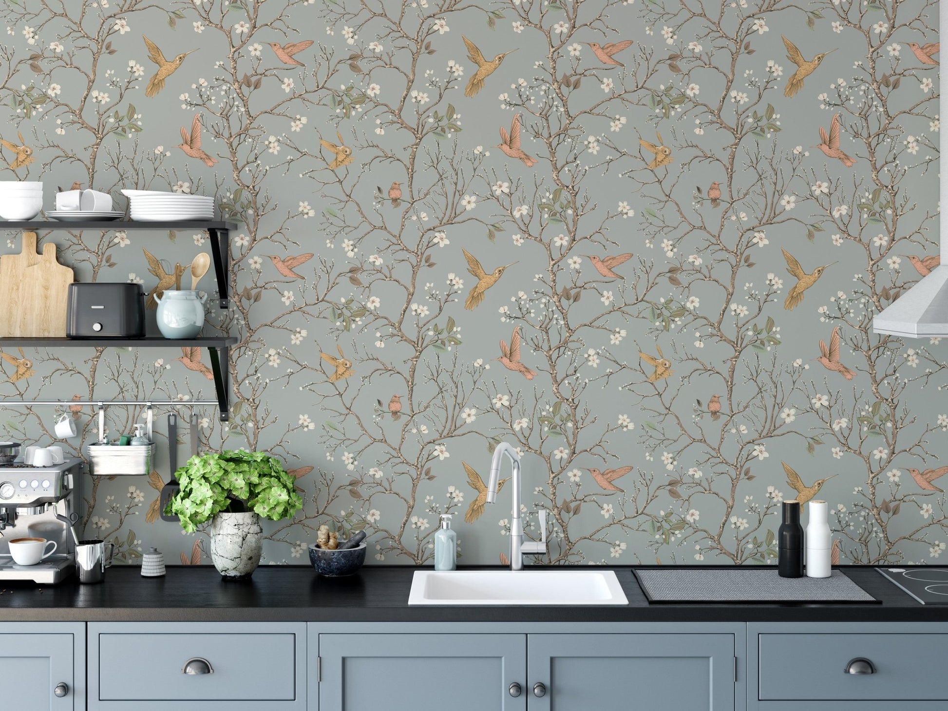 Vintage Garden with Hummingbirds Wallpaper in a modern kitchen with blue cabinets.