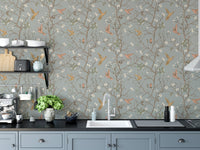 Vintage Garden with Hummingbirds Wallpaper in a modern kitchen with blue cabinets.