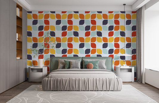 Vintage leaf pattern wallpaper behind a minimalist bed in a bright bedroom.
