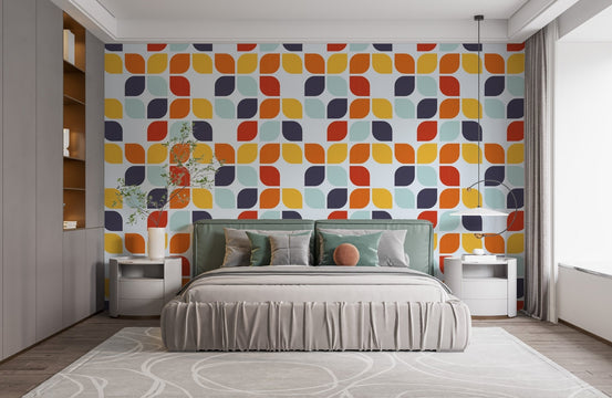 Vintage leaf pattern wallpaper behind a minimalist bed in a bright bedroom.
