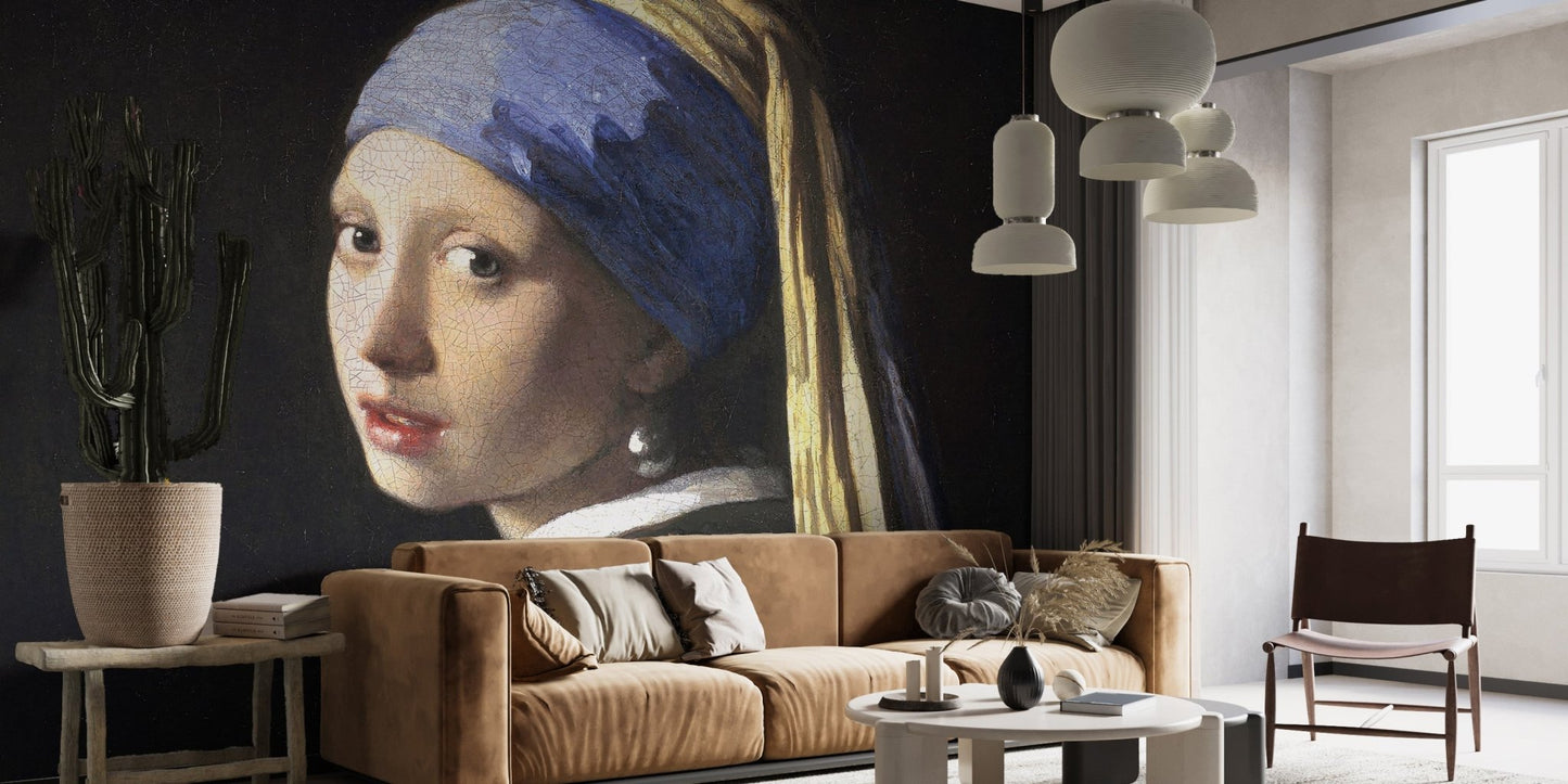 Classic portrait wall mural behind a tan leather sofa in a minimalist living room.