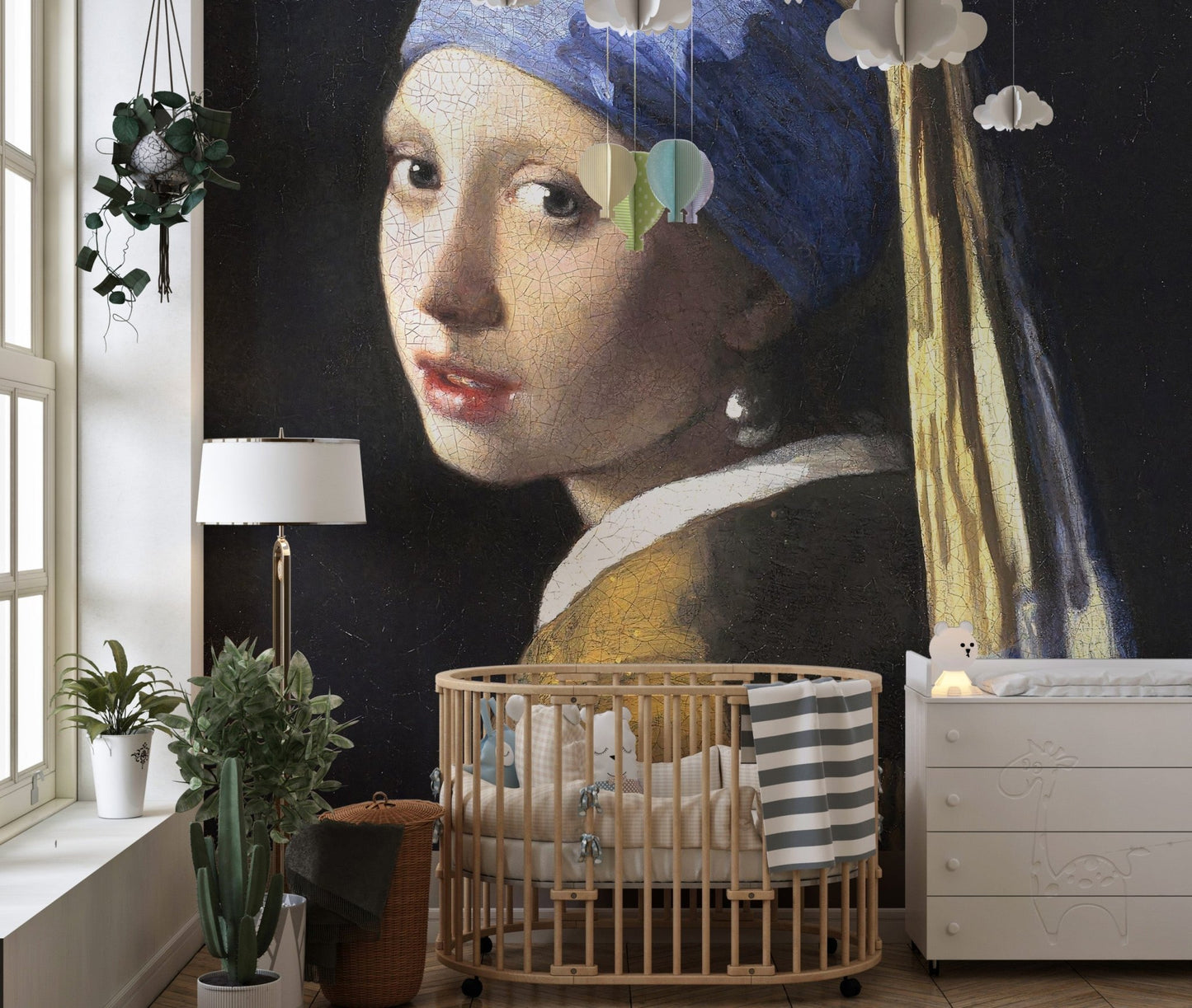 Girl with a pearl earring wall mural next to a wooden baby cot in a nursery.