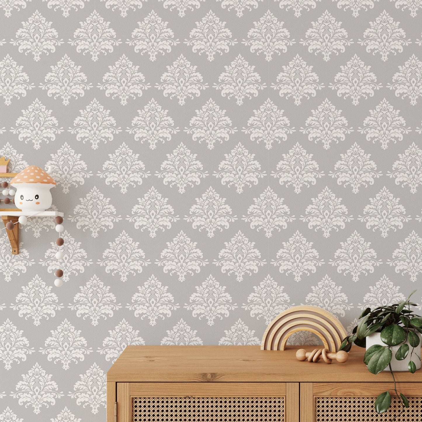 Light grey damask pattern wallpaper on a room feature wall with a large window.