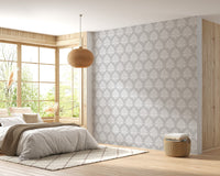 Subtle grey damask wallpaper in a sunlit room with a round pendant light.