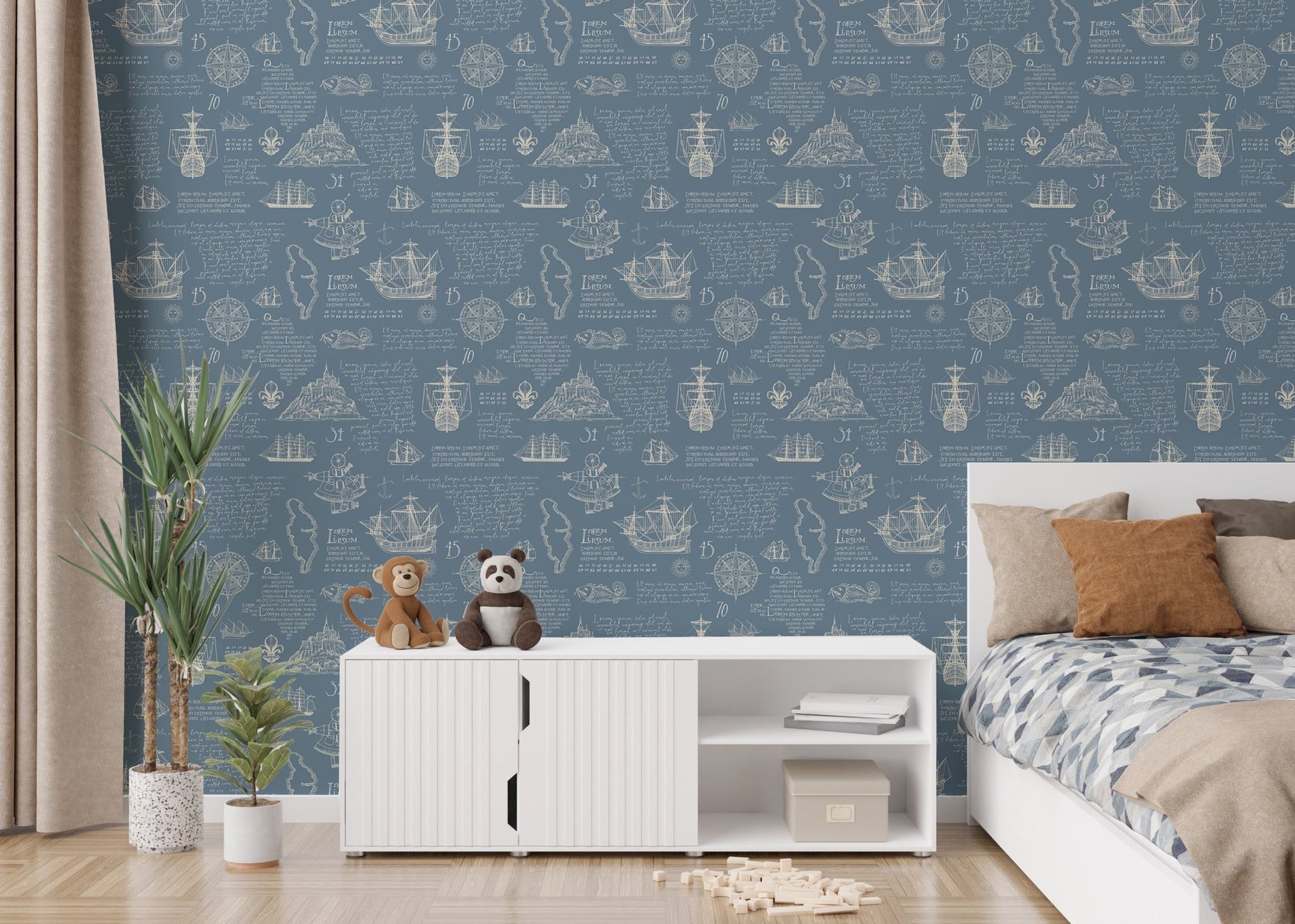 Blue wall mural with manuscript patterns in a bedroom with a white bed