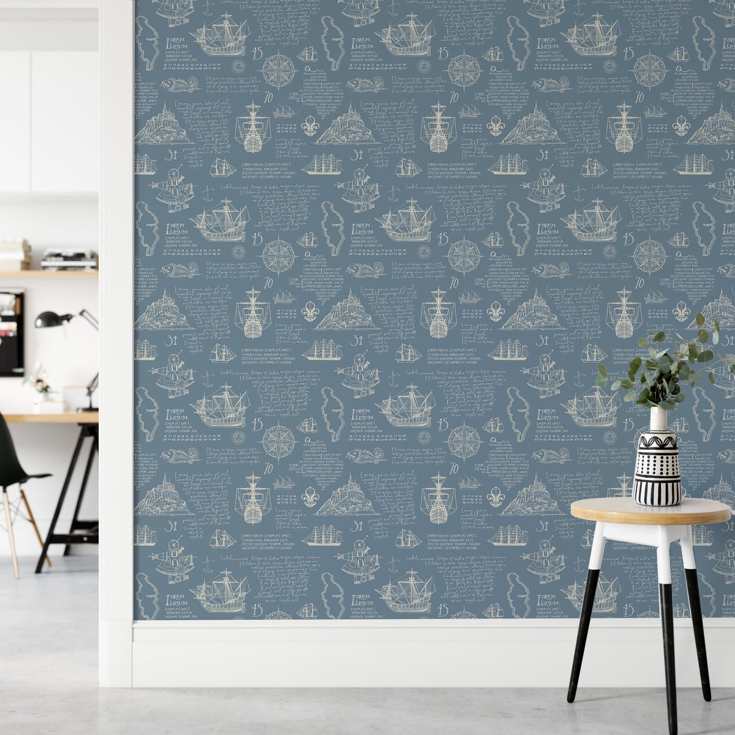 Blue vintage wall mural with white nautical illustrations on a hallway wall