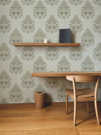Home workspace featuring a wooden chair and Vintage Milan Damask Green Wallpaper.