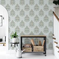 Entryway console table against a Vintage Milan Damask Green Wallpaper surface.