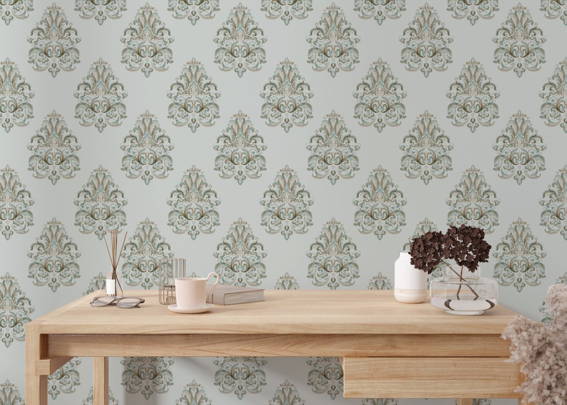 Minimalist office space with a wooden desk against green damask wallpaper.