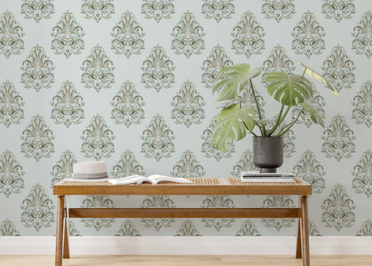 Vintage Milan Damask Green Wallpaper behind a wooden bench with a green plant.