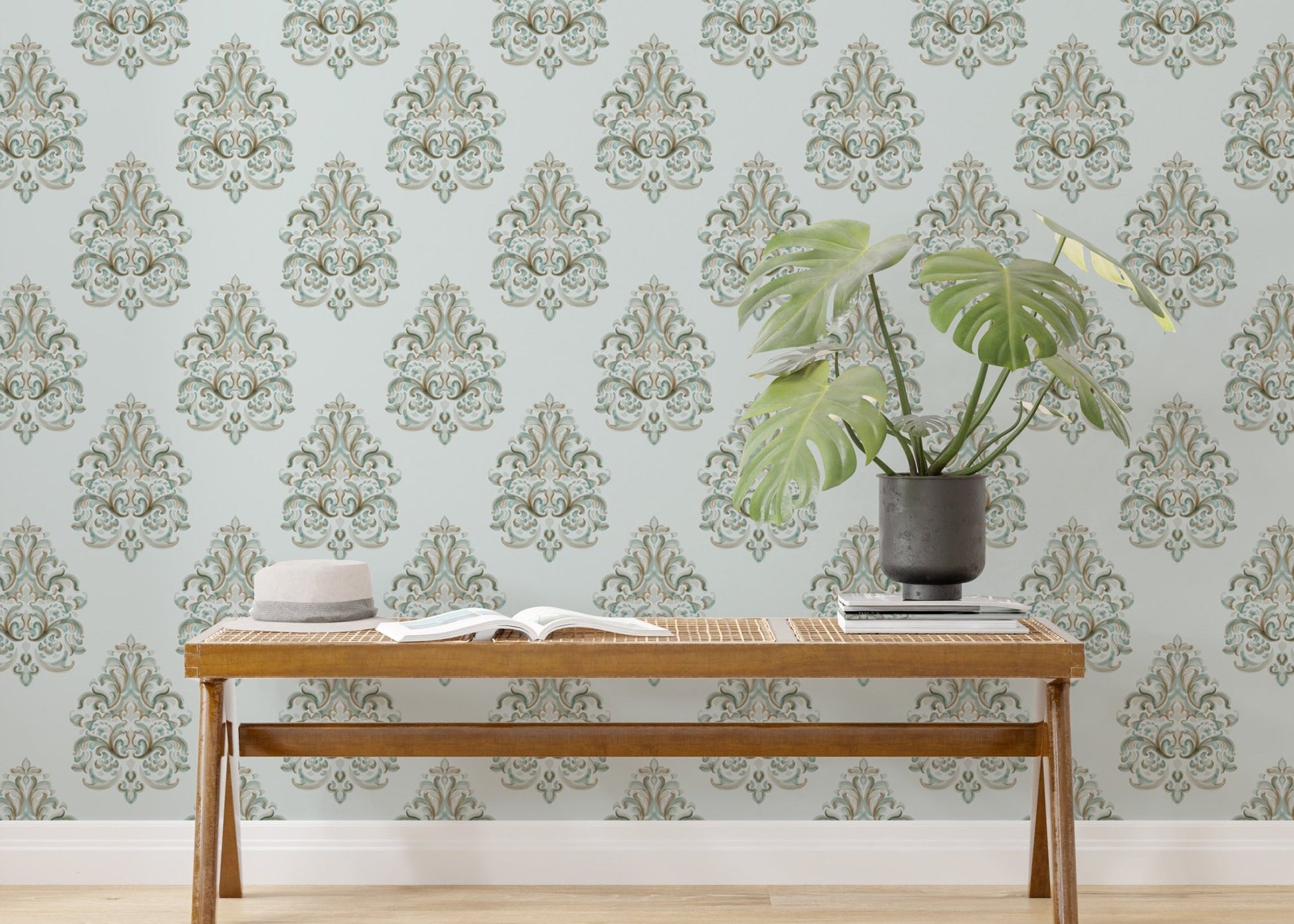 Vintage Milan Damask Green Wallpaper behind a wooden bench with a green plant.