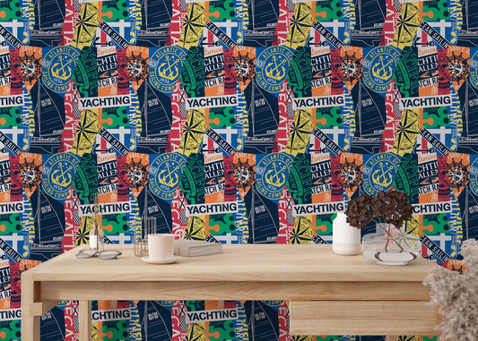 Vintage nautical style wallpaper on a study wall behind a light wood desk.