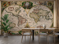 Large world map wall mural in a dining area with wooden chairs.