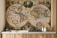 Old world map wall mural in a kitchen with light wood cabinets.
