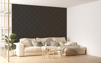 Large scale black damask wallpaper in a bright open plan living space with a sofa