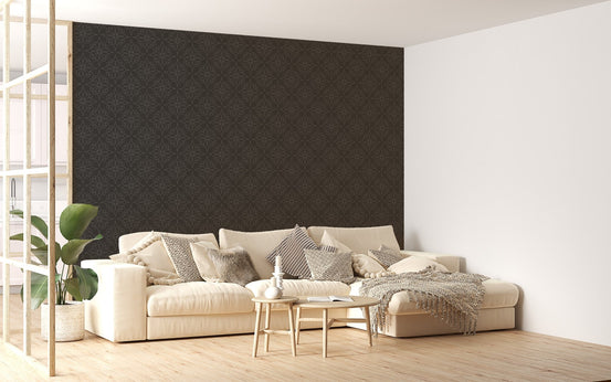 Large scale black damask wallpaper in a bright open plan living space with a sofa