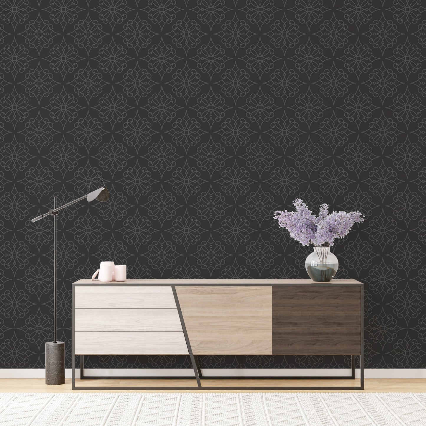 Black damask wallpaper behind a modern wooden sideboard in a minimalist living room