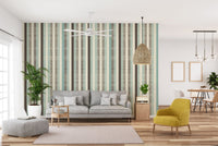 Open plan living space with Vintage Pastel Stripes wall mural and a yellow armchair.