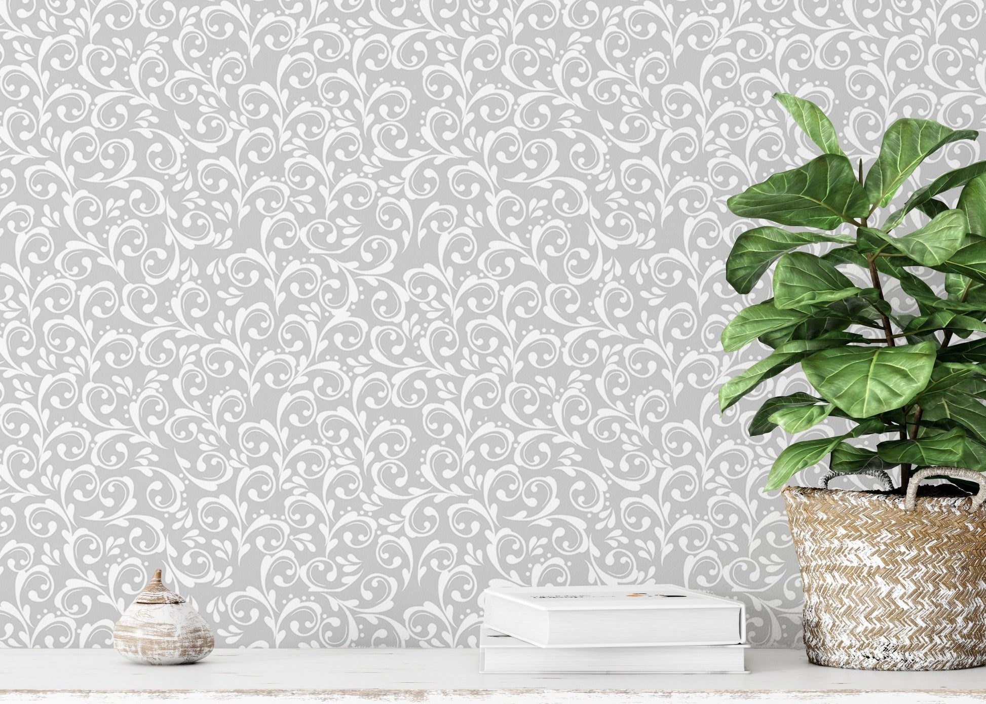 Vintage royal elegant damask pattern wallpaper behind a white shelf and potted plant.