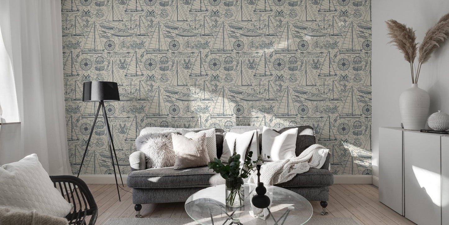 Nautical collage wallpaper behind a grey sofa in a modern living room.